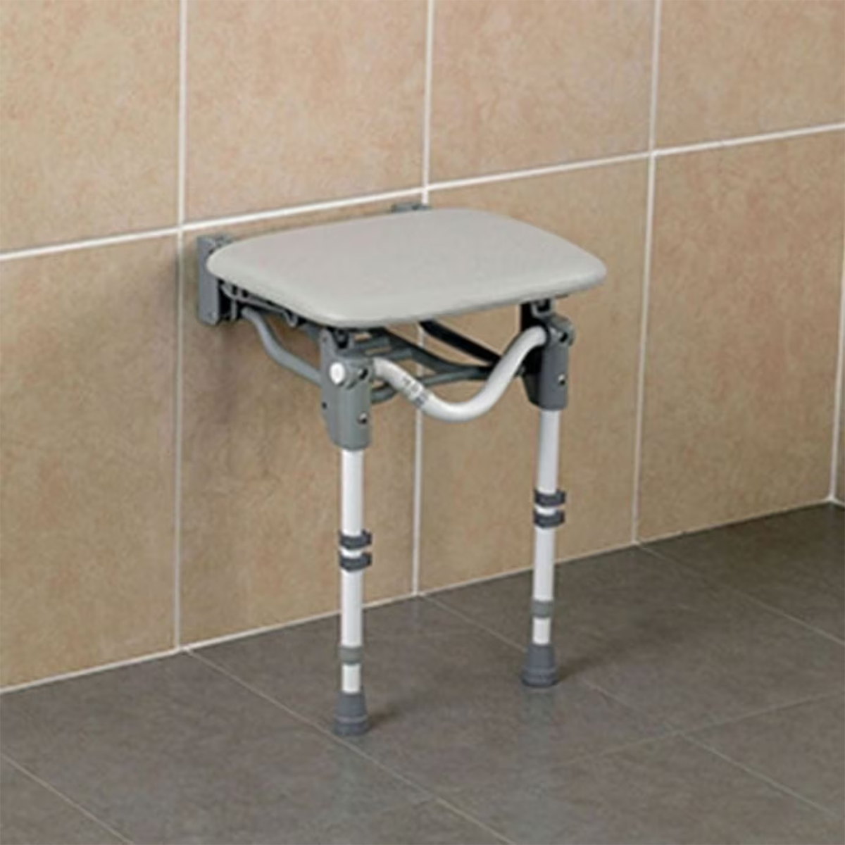 Tooting Wall Mounted shower Seat fitted to a shower wall in the seating position, ready to use